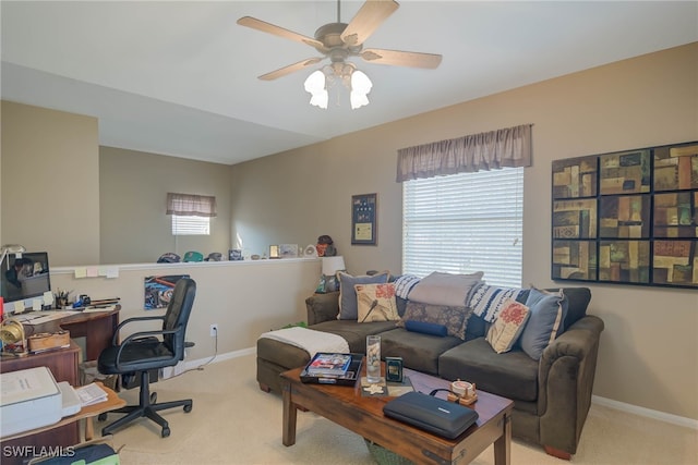 carpeted home office with ceiling fan