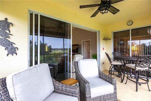 view of patio / terrace featuring ceiling fan