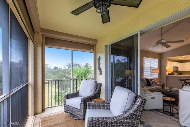 sunroom / solarium with vaulted ceiling and ceiling fan