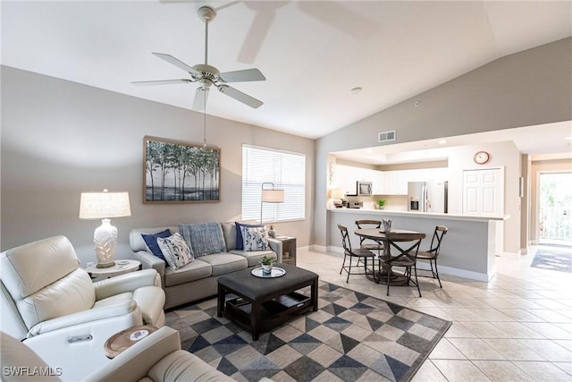 tiled living room with vaulted ceiling and ceiling fan