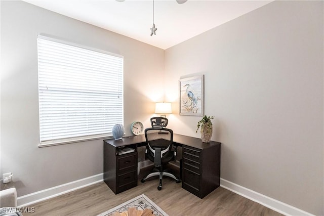 office space with light hardwood / wood-style floors