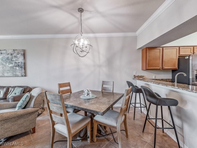 dining space with light tile patterned flooring, a chandelier, and crown molding