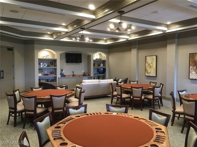 carpeted dining area featuring coffered ceiling, ornamental molding, a chandelier, beam ceiling, and built in shelves