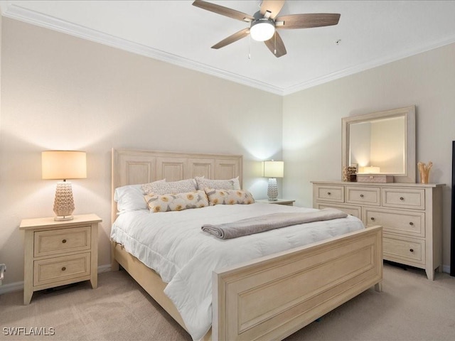 bedroom featuring ceiling fan, light colored carpet, and crown molding