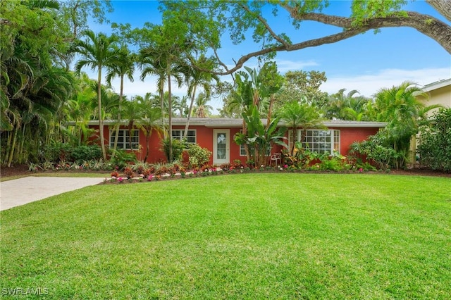 ranch-style house with a front yard