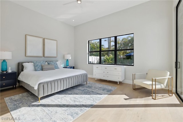 bedroom featuring ceiling fan and light hardwood / wood-style flooring