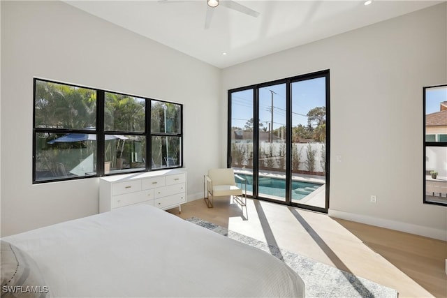 bedroom with ceiling fan, light hardwood / wood-style flooring, and access to outside