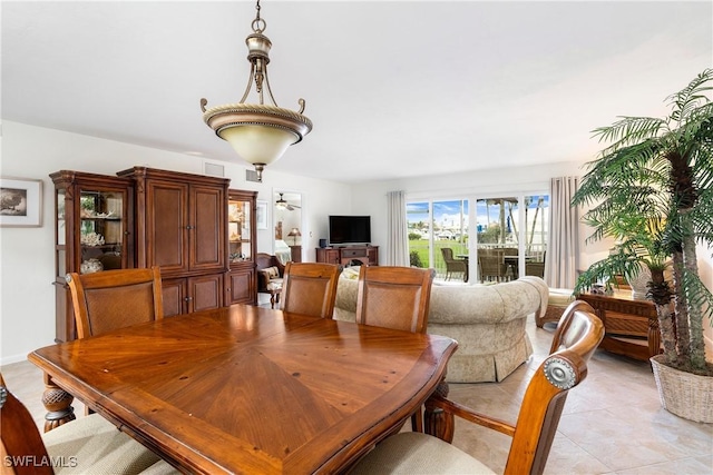 dining area featuring light tile patterned floors