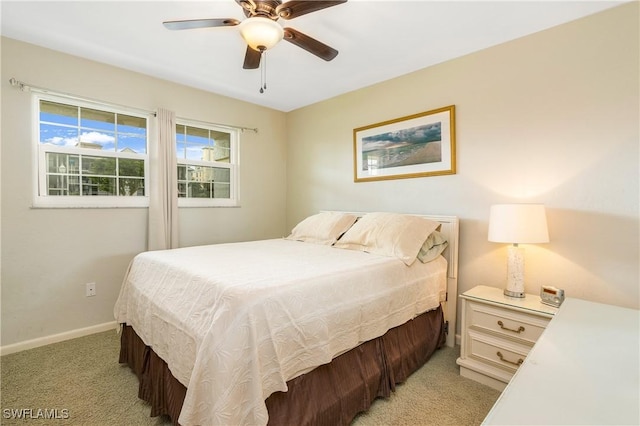 bedroom featuring ceiling fan and light colored carpet