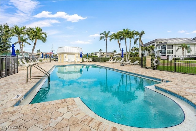 view of swimming pool featuring a patio area