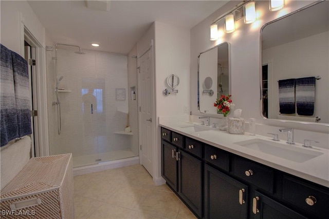 bathroom featuring walk in shower, tile patterned floors, and vanity