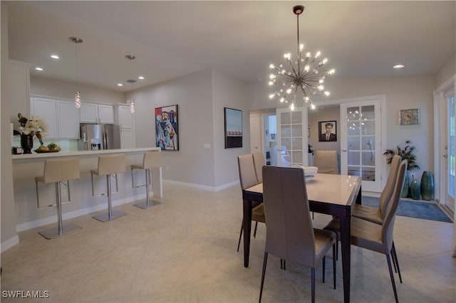 dining area with french doors and a notable chandelier