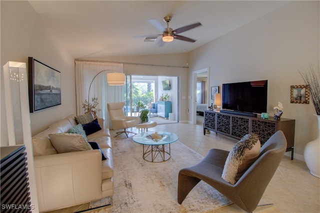 tiled living room featuring vaulted ceiling and ceiling fan