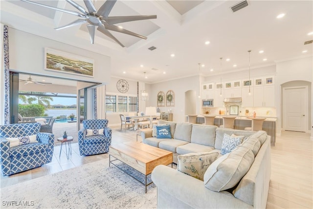 living room with ceiling fan, ornamental molding, beam ceiling, and coffered ceiling