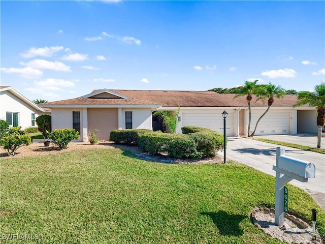 ranch-style home with a front lawn and a garage