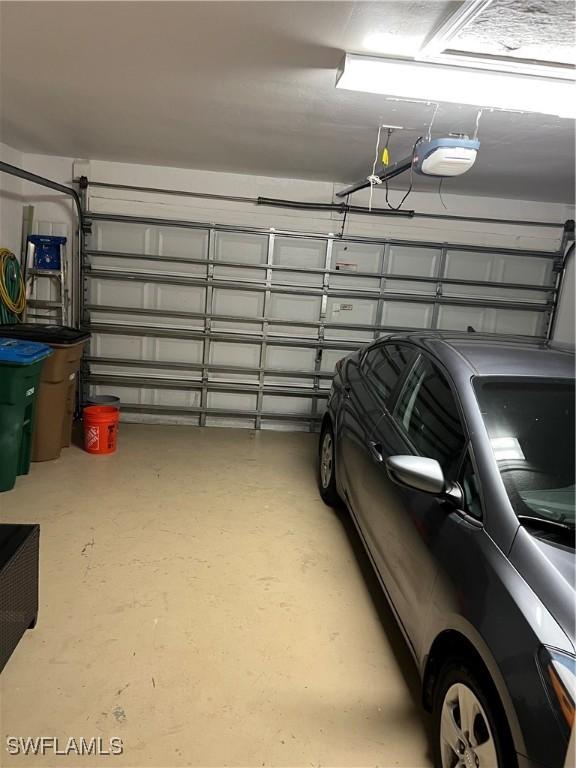 garage featuring a garage door opener