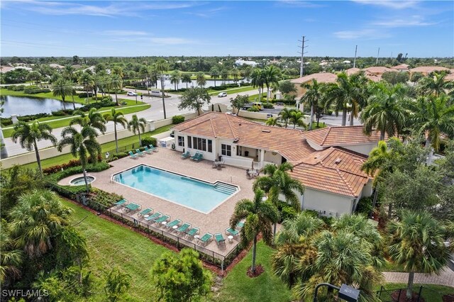 birds eye view of property with a water view