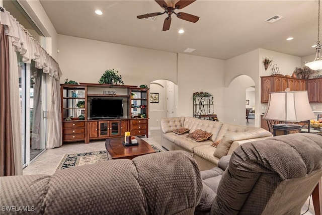 tiled living room featuring ceiling fan