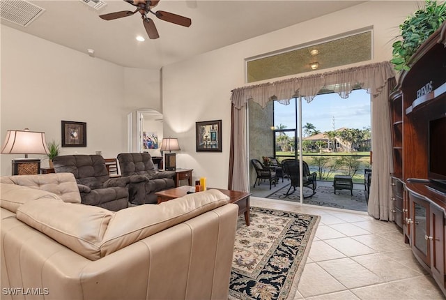 living room with light tile patterned flooring and ceiling fan