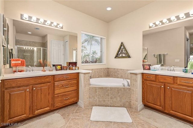 bathroom featuring tile patterned flooring, vanity, and independent shower and bath