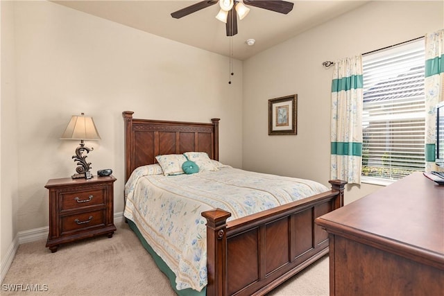 bedroom with light colored carpet and ceiling fan