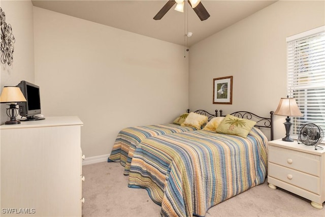 bedroom with light carpet and ceiling fan