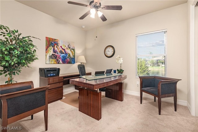 office space with light colored carpet and ceiling fan