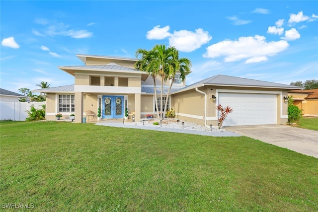 view of front facade featuring french doors, a front lawn, and a garage