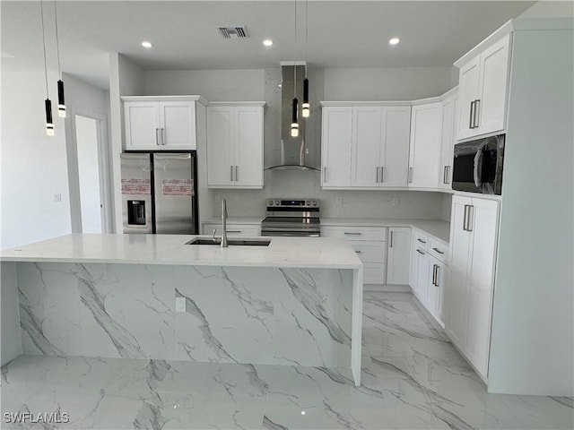 kitchen with wall chimney range hood, visible vents, marble finish floor, a sink, and stainless steel appliances