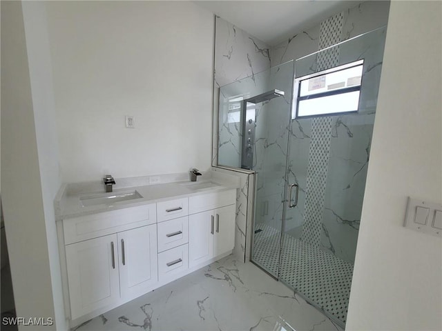 bathroom featuring an enclosed shower and vanity