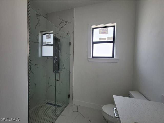 bathroom featuring baseboards, toilet, vanity, a marble finish shower, and marble finish floor