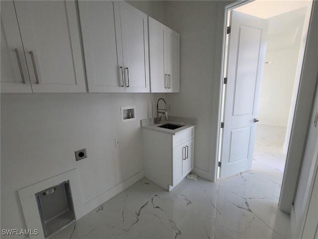 washroom featuring sink, cabinets, hookup for a washing machine, and hookup for an electric dryer