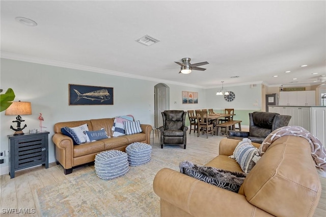 living room with ceiling fan, light hardwood / wood-style floors, and ornamental molding