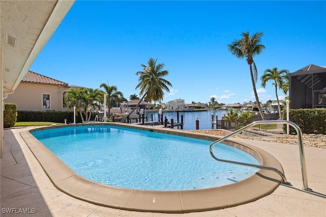 view of pool with a water view