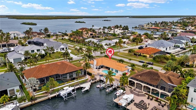 birds eye view of property with a water view