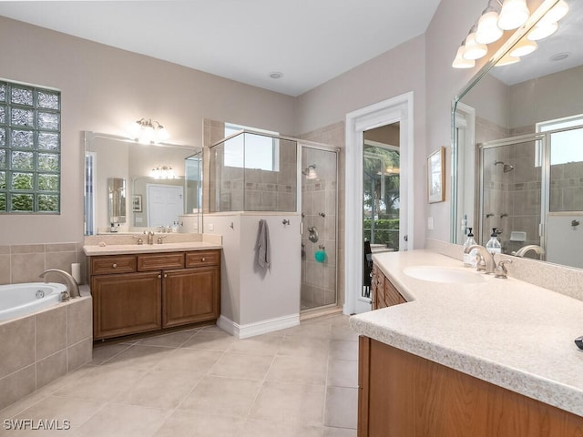 bathroom with vanity, independent shower and bath, and tile patterned flooring