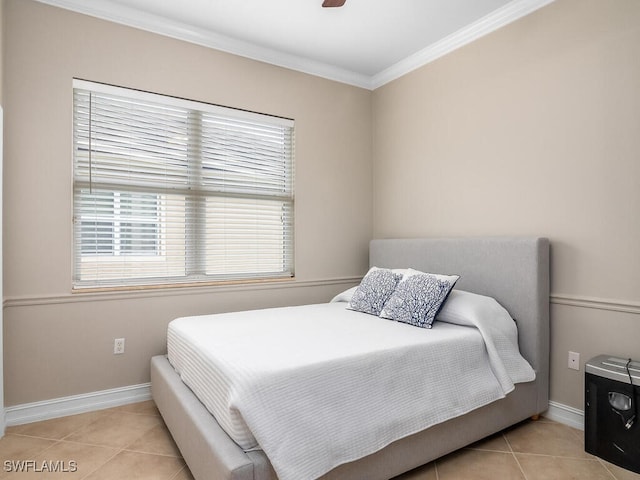 bedroom featuring ornamental molding, ceiling fan, and light tile patterned flooring