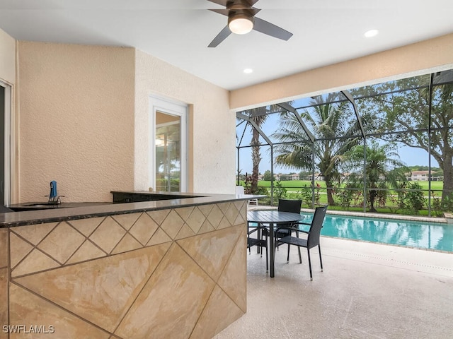 interior space with a lanai and ceiling fan