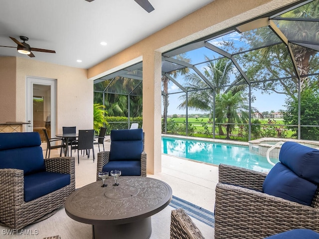 view of swimming pool featuring ceiling fan