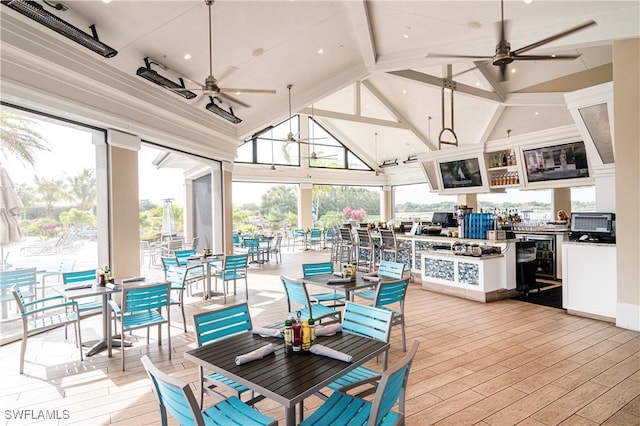 interior space with lofted ceiling and ceiling fan