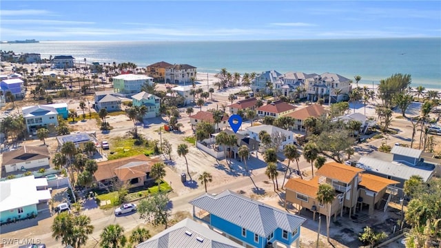 bird's eye view featuring a water view and a residential view