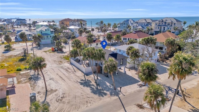 bird's eye view featuring a water view and a residential view