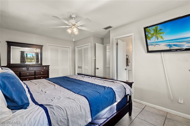 tiled bedroom with ceiling fan