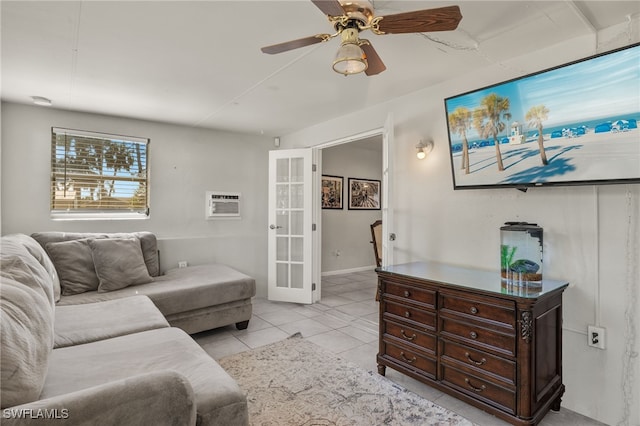 tiled living room featuring french doors, ceiling fan, and a wall mounted AC