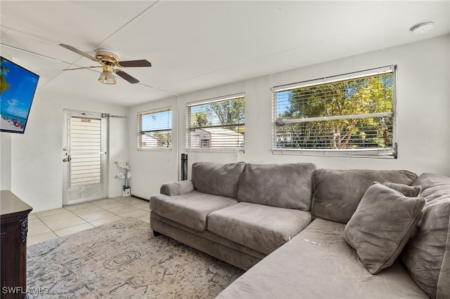 living room with light tile patterned flooring and ceiling fan