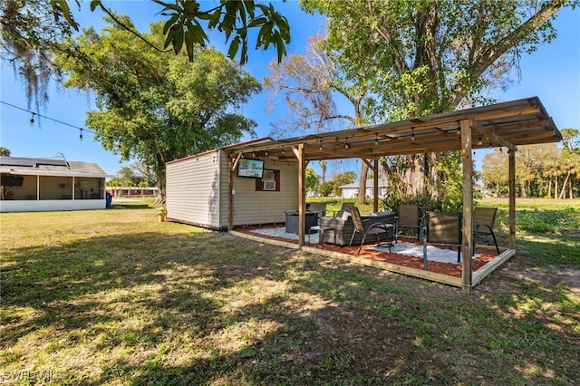 view of yard featuring a pergola and a sunroom