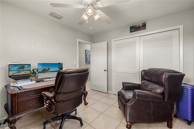 home office with ceiling fan and light tile patterned floors