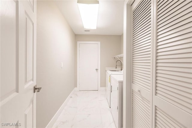 laundry room with washer and dryer