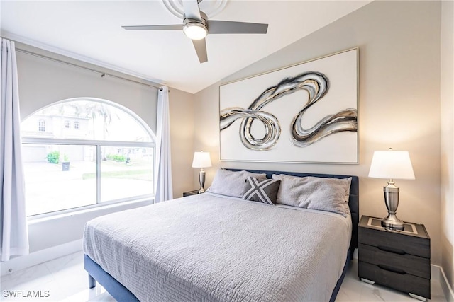 bedroom with ceiling fan and vaulted ceiling