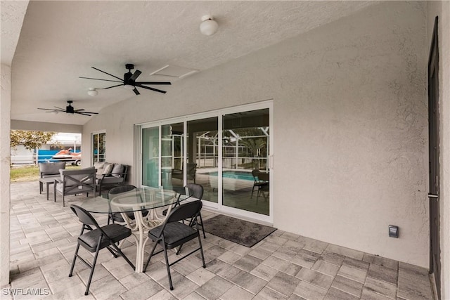 view of patio featuring ceiling fan